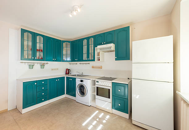 istock Modern Kitchen Interior With Teal Cabinets and Household Appliances 2218662888