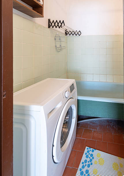 istock Laundry Room Interior with Washing Machine and Utility Tub 2218662956