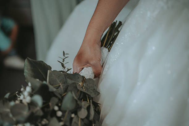 istock Bridal flower bouquet during a wedding ceremony 2218663292