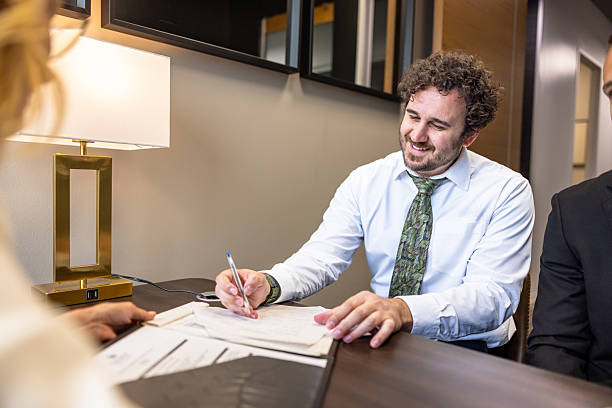 istock Young male employee signing an agreement 2218667949