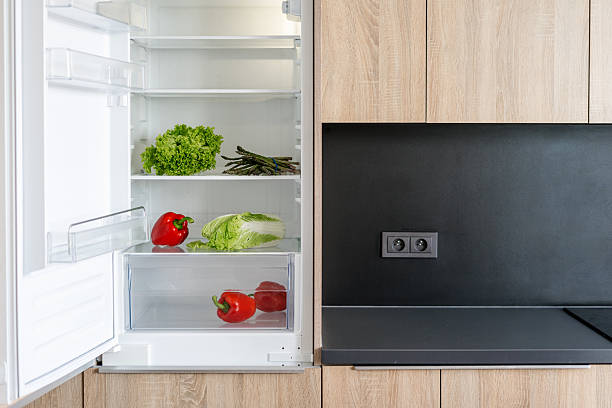 istock Fresh vegetables stored inside an open modern refrigerator in a sleek kitchen 2218668108