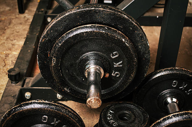 istock Strength training corner in basement with dumbbells and iron weights 2218668812