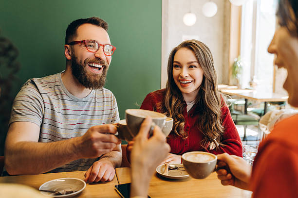 istock Friends toasting cappuccino, enjoying coffee break at cafe 2218670164