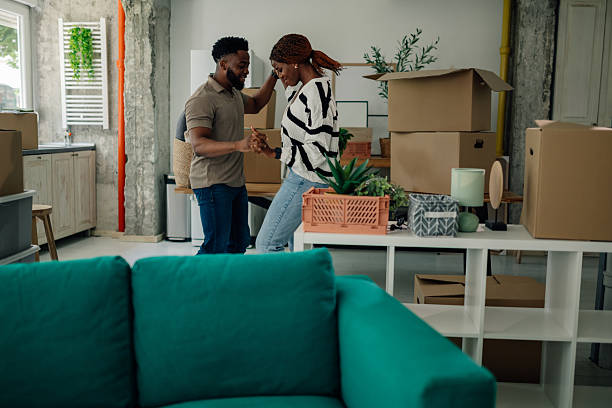 istock Happy couple dancing and celebrating moving into new home 2218674311