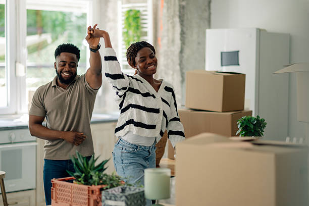 istock Happy couple dancing and celebrating moving into new home 2218674314