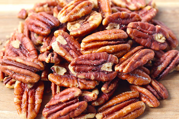 istock Delicious salted pecan nuts scattered. 2218676583
