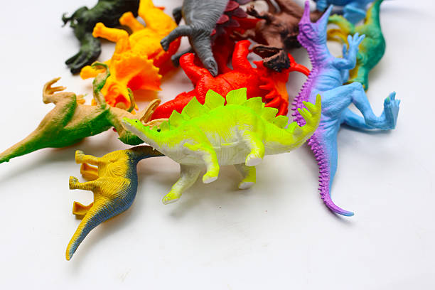istock Plastic dinosaur toys on white background 2218677945