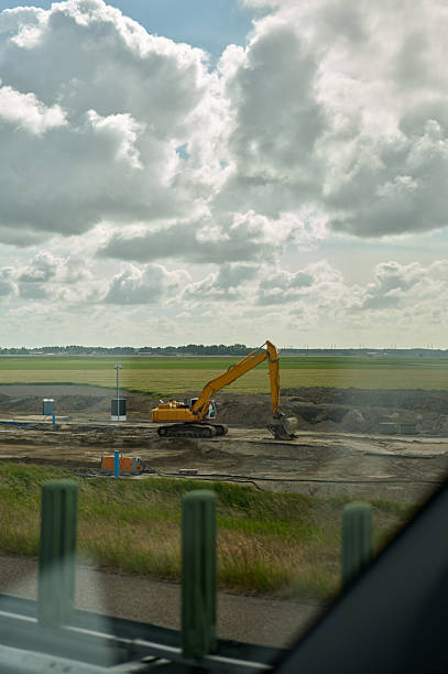 earth moving equipment rebuilding road