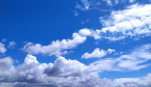 istock Serene blue sky with fluffy white clouds. Perfect for conveying hope, freedom, or a bright future. Use as background for websites, presentations, or designs. 2218683481