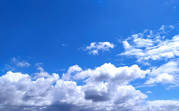 istock Bright blue sky filled with fluffy white clouds. Represents freedom, peace, and expansiveness. Ideal for backgrounds, travel, weather, or motivational concepts. 2218683494