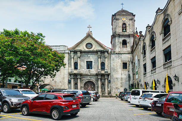 San Agustin Church, historic 16th century church, in downtown Manila, Philippines on a sunny day.