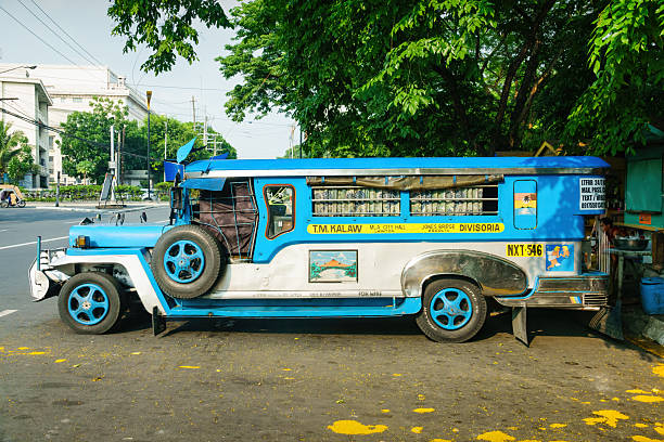 Baguio City, Benguet Province, Philippines - May 5, 2012: Front low-angle view of colorful jeepneys parking at a steep street in downtown area
