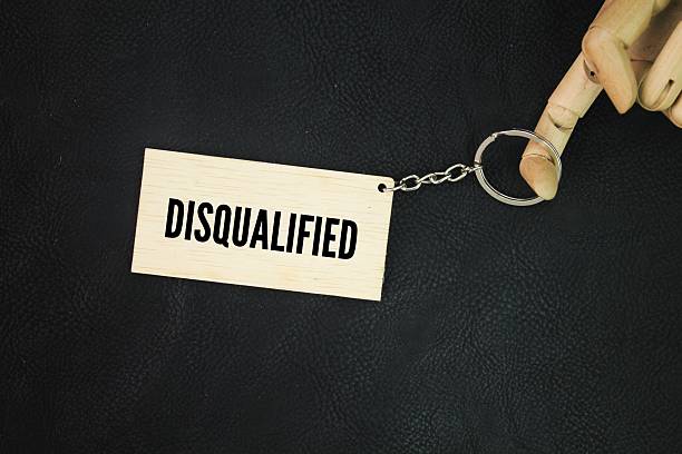 istock wooden keychain with the words disqualified. not qualified or unqualified 2218689086