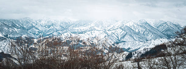 istock A breathtaking panoramic view of snow-covered mountain ranges including Ishiuchi Maruyama, Yuzawa Kogen, and distant peaks near Echigo-Yuzawa in Niigata, Japan, captured from Gala Yuzawa station. 2218691471