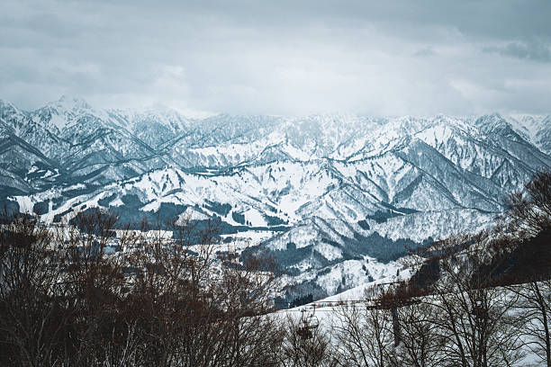 istock A breathtaking panoramic view of snow-covered mountain ranges including Ishiuchi Maruyama, Yuzawa Kogen, and distant peaks near Echigo-Yuzawa in Niigata, Japan, captured from Gala Yuzawa station. 2218691479