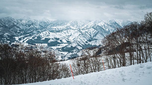 istock A breathtaking panoramic view of snow-covered mountain ranges including Ishiuchi Maruyama, Yuzawa Kogen, and distant peaks near Echigo-Yuzawa in Niigata, Japan, captured from Gala Yuzawa station. 2218691480