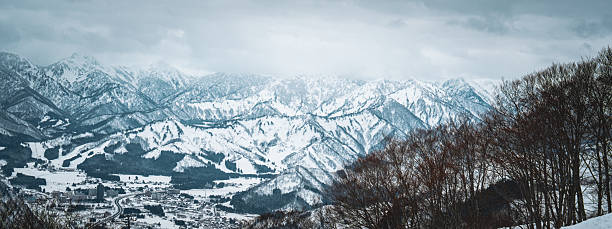 istock A breathtaking panoramic view of snow-covered mountain ranges including Ishiuchi Maruyama, Yuzawa Kogen, and distant peaks near Echigo-Yuzawa in Niigata, Japan, captured from Gala Yuzawa station. 2218691484