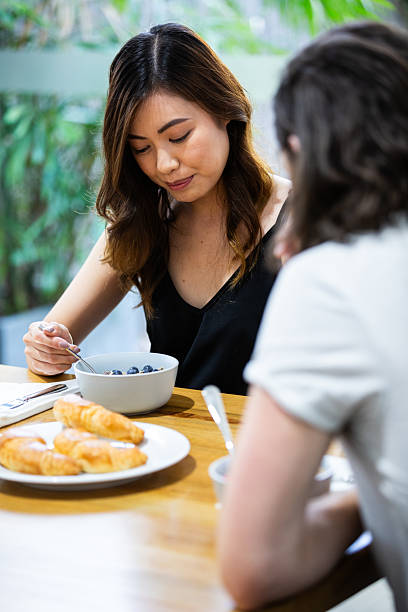 istock Young couple at breakfast together 2218692152