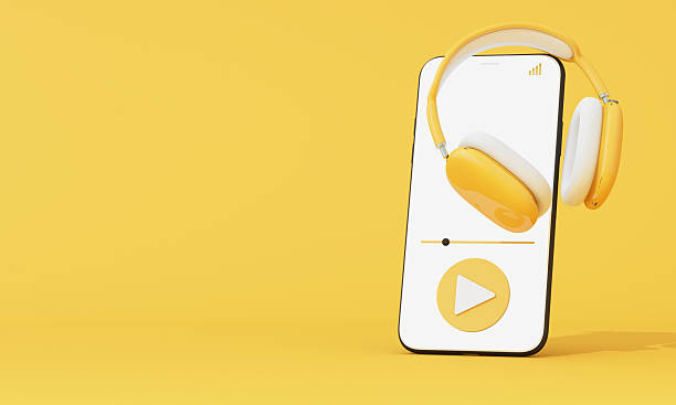 istock Minimalist mobile phone interface with headphones and audio controls on yellow background. Clean 3D concept for listening apps. 3d rendering 2218695578