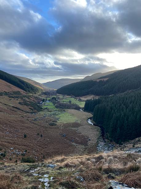 istock Dramatic Sunlight Breaking Through Clouds Over Glenmacnass Valley, Ireland 2218696382