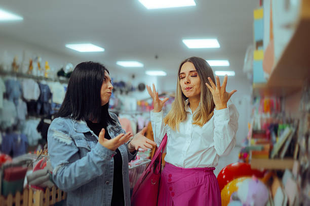 istock Women Argue in a Store Causing a Troubled Situation 2218696893
