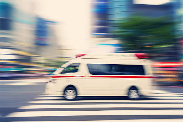 Tokyo Ambulance in Motion Across Crosswalk