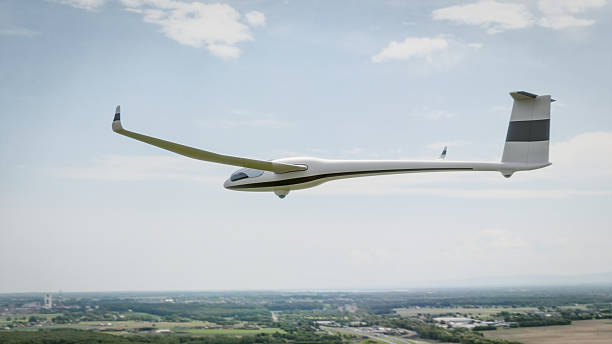 istock A sleek, white glider soars gracefully over a picturesque landscape 2218699299