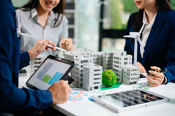istock Discussion among businesspeople on the latest developments in solar cell panel technology and Solar Energy Environment city 2218701513
