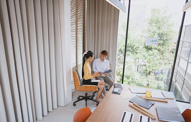 istock group of business people collaborating on new project in office 2218702574