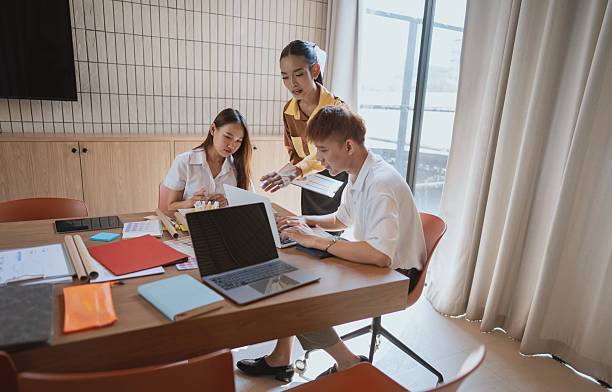 istock group of business people collaborating on new project in office 2218702580