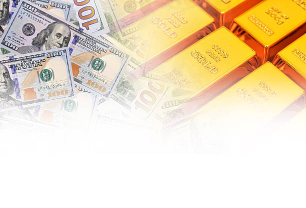 Gold bars and US dollar bill banknotes background. online concept asset commodity trading or buy gold bars for investment