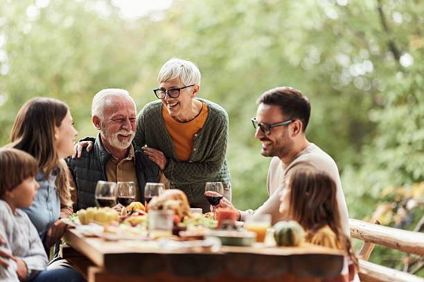 istock Happy multi-generation family enjoying in lunch in nature. 2218709694
