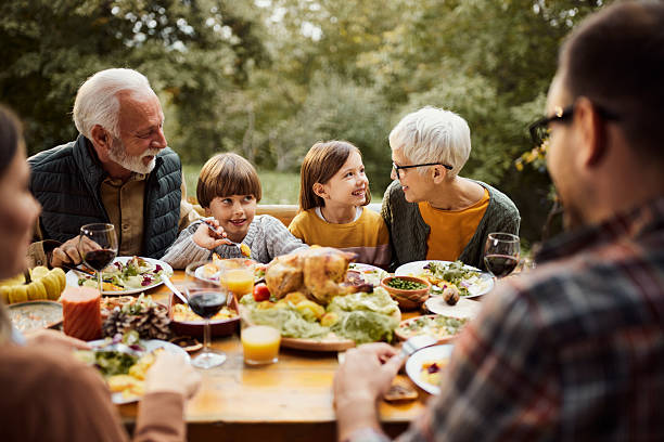 istock Happy multi-generation family having lunch in nature. 2218710008
