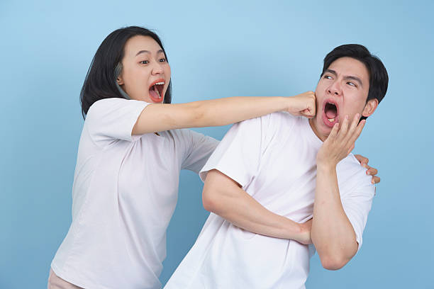 istock Couple Playfully Interacts Showing Amusement and Laughter in Fun Atmosphere 2218710305