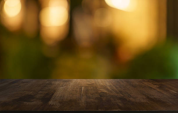 istock Empty wood table top and blur of restaurant background selective focus product display 2218712412