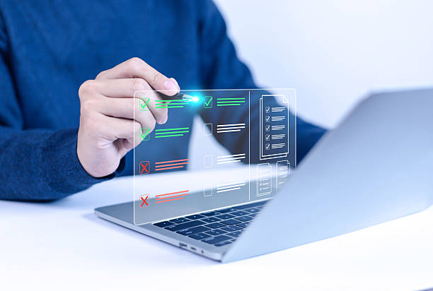 istock Businessman working on computer using laptop. Concept of business performance tracking and evaluation. Document management system DMS. Performance checklist evaluation form. 2218713116