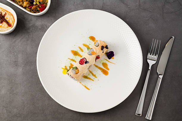 istock Rolled crispy crepe filled with seafood, herbs, and microgreens 2218713390