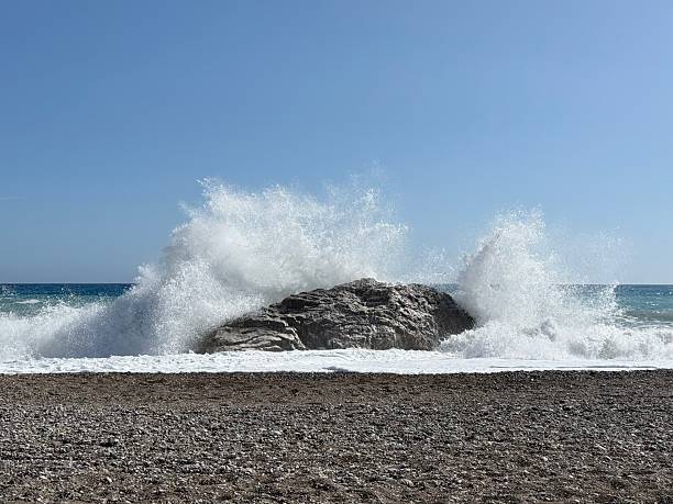 istock Rocky shore and crashing waves 2218720463