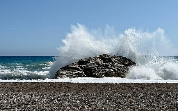 istock Rocky shore and crashing waves 2218720556