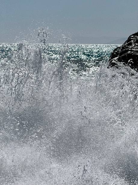 istock Rocky shore and crashing waves 2218720574