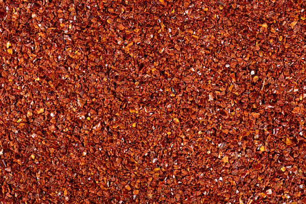 istock Spicy ground chili pepper close-up texture top view 2218721573