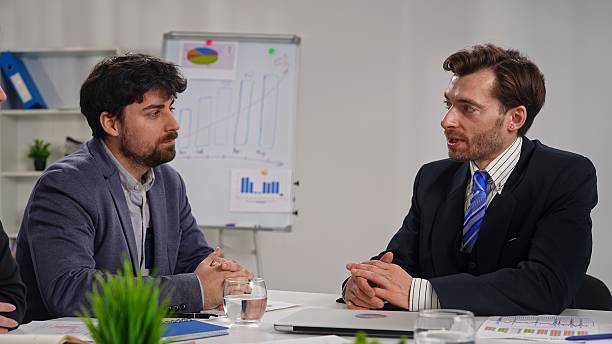 istock Two Businessmen on Business Project in Office Setting 2218723306