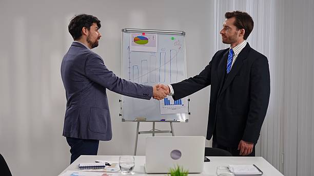 istock Two Businessmen Shaking Hands After a Successful Meeting 2218723531
