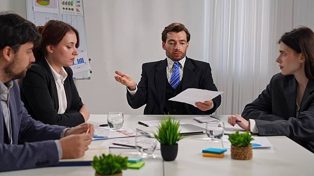 istock Business Meeting with Four People in Office Setting 2218724264