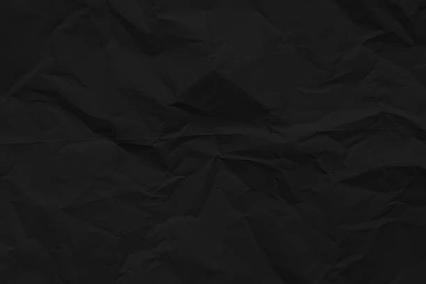 istock Empty blank dark crispy shiny black colored old crumpled crushed creased recycled grainy textured paper horizontal vector backgrounds 2218725508