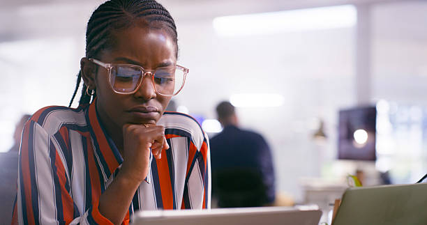 istock Businesswoman Deep in Thought While Working on a Digital Device in an Office Setting 2218727992
