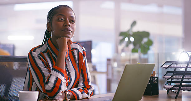 istock Confident Business Professional in a Reflective Moment at a Modern Office Desk 2218728005