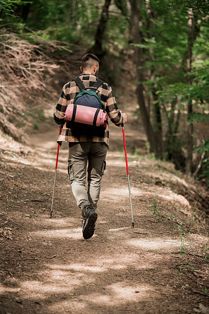 istock Young Man Hiking Alone in Nature 2218729055