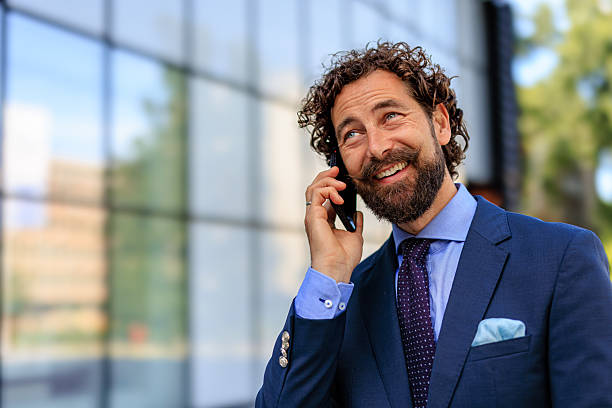 istock Close-up Corporate Professional Communicating on Mobile Outdoors 2218732437