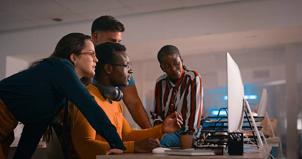 istock Diverse Team Collaborating in a Modern Office Over Technology in Evening Light 2218732543